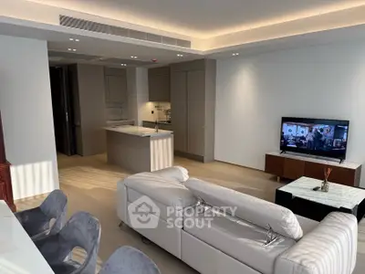 Modern living room with open kitchen and stylish furniture