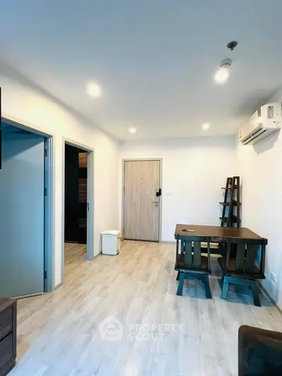 Modern apartment interior with wooden flooring and minimalist furniture