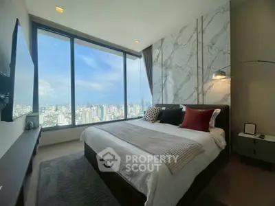 Luxurious bedroom with stunning city view and modern decor