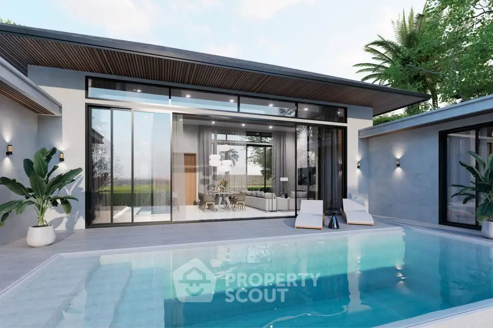Luxurious modern villa with sleek pool and spacious patio, perfect for relaxation and entertainment.