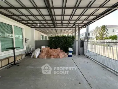 Spacious covered parking area with storage potential in modern residential property.