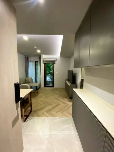 Modern living room with sleek design and balcony view