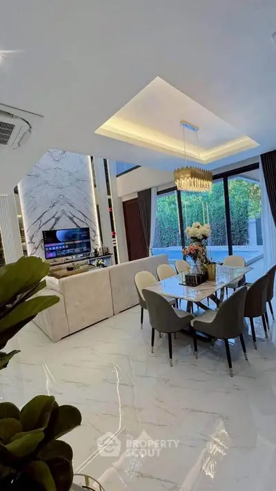 Luxurious open-plan living room with elegant dining area and modern decor