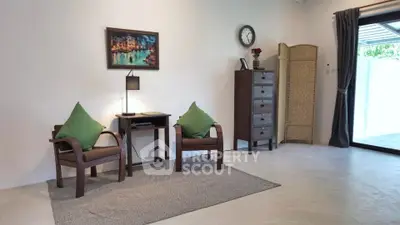 Charming living room with elegant furniture and natural light, perfect for relaxation and entertaining.