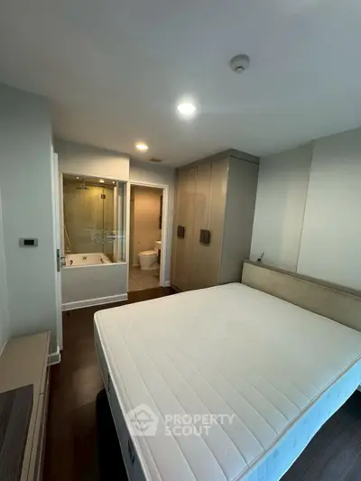 Modern bedroom with ensuite bathroom and spacious wardrobe