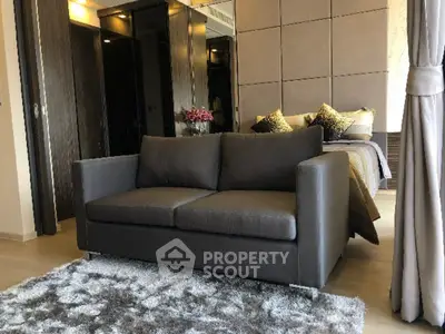 Modern bedroom with cozy sofa and stylish decor