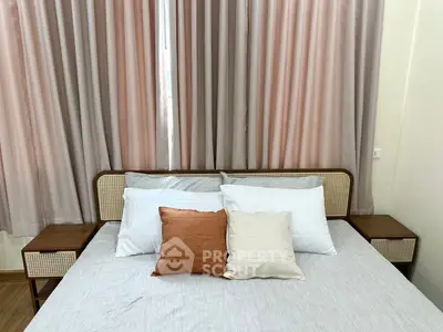 Cozy bedroom with stylish bed and elegant curtains, perfect for relaxation.