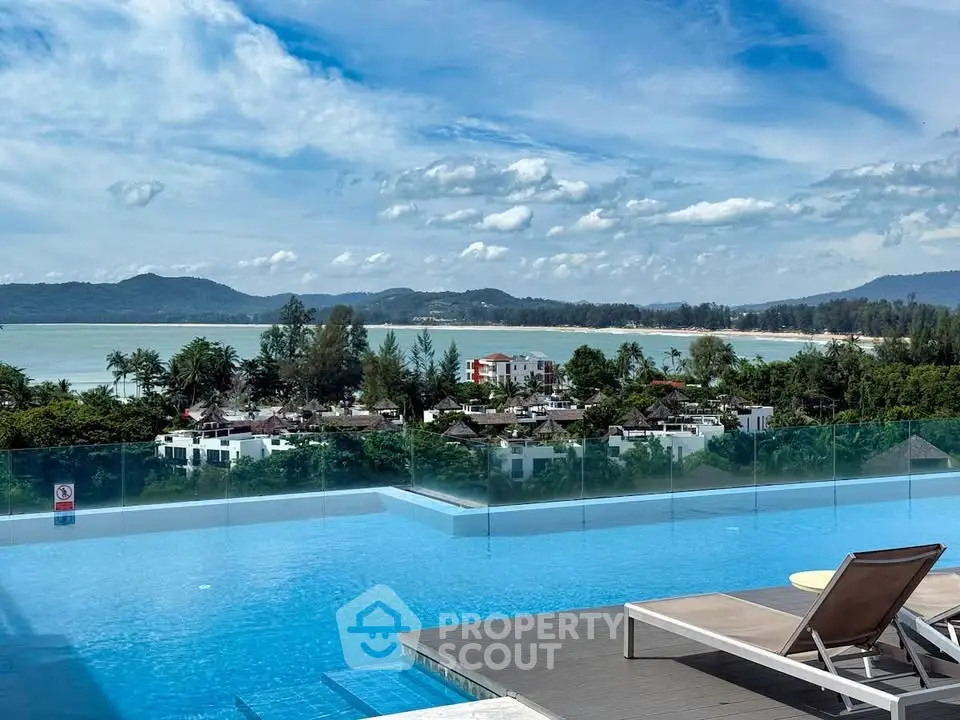 Stunning rooftop pool with breathtaking ocean view and lush greenery, perfect for luxury living.