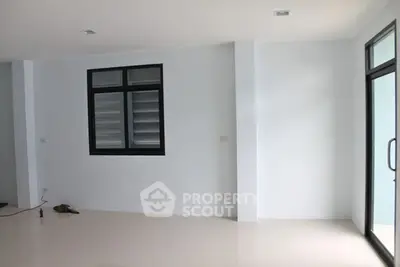 Spacious unfurnished room with large windows and glossy floor, perfect for customization.