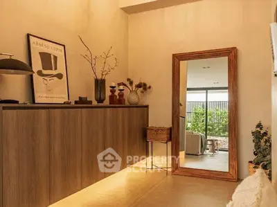 Stylish interior with elegant decor and large mirror reflecting a cozy living space.