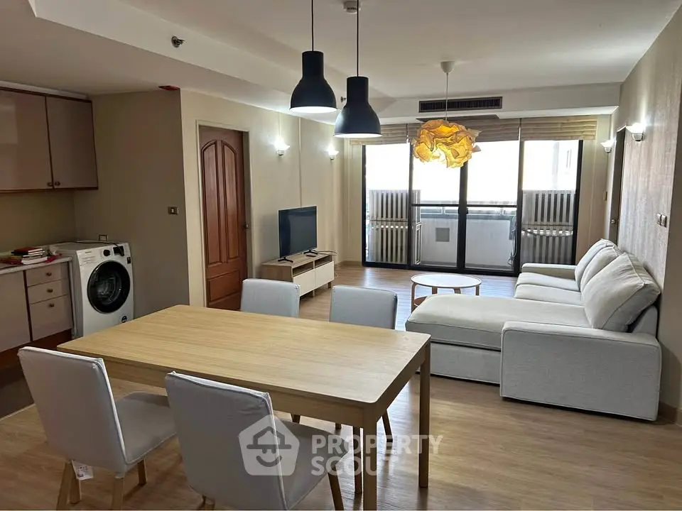 Spacious modern living room with open kitchen and stylish furniture