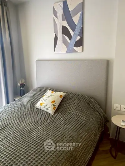 Modern bedroom with stylish decor and cozy bedding