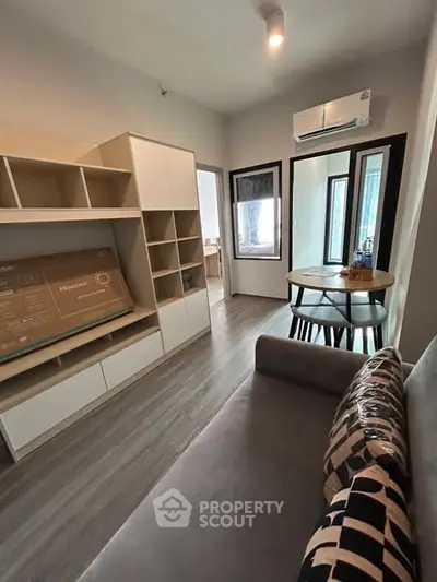 Modern living room with stylish furniture and air conditioning