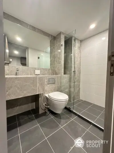 Modern bathroom with sleek design and glass shower enclosure