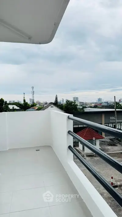 Spacious balcony with city view, perfect for relaxation and enjoying the skyline.