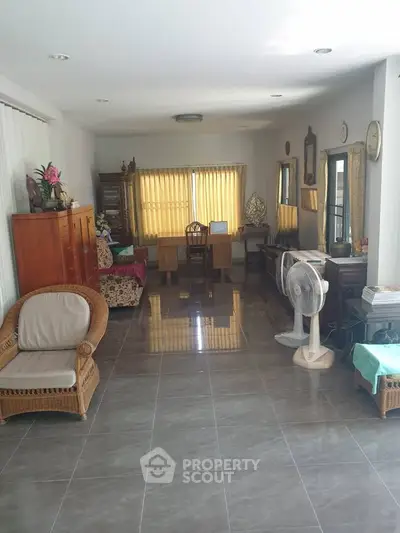 Spacious living room with elegant furniture and large windows for natural light.
