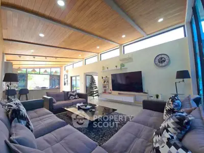 Spacious modern living room with large windows and stylish decor