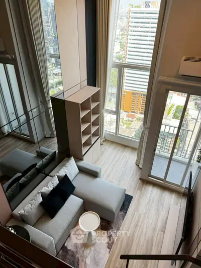 Modern high-rise living room with stunning city view and stylish furniture