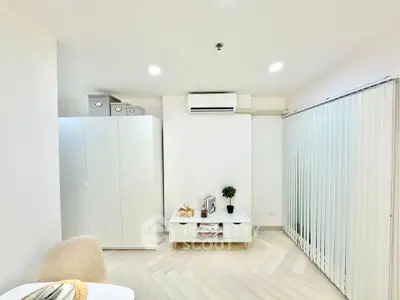 Modern living room with minimalist decor and air conditioning