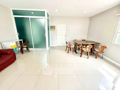 Spacious living room with modern furniture and large windows