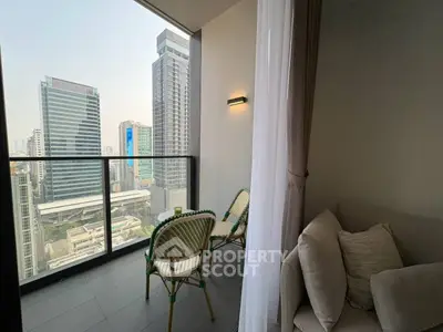 Modern balcony with city view, cozy seating, and elegant design in urban high-rise.
