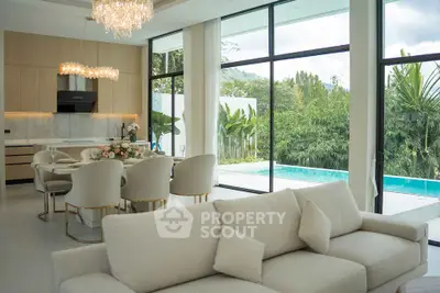 Luxurious open-plan living room with pool view and elegant dining area