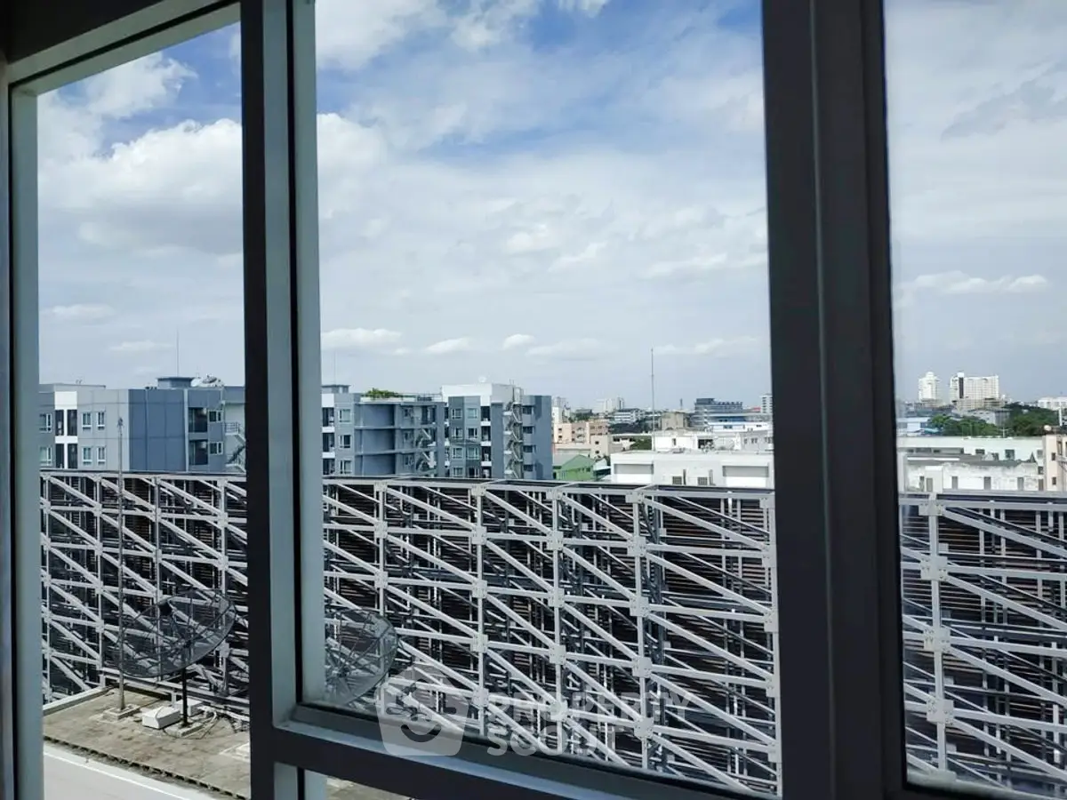 Stunning cityscape view from a modern apartment window, showcasing urban living at its finest.