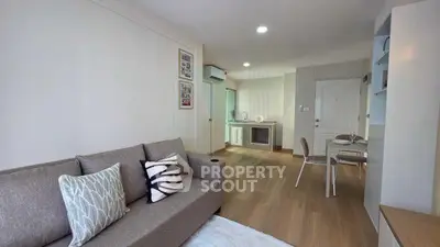 Modern living room with cozy sofa and dining area in open layout apartment