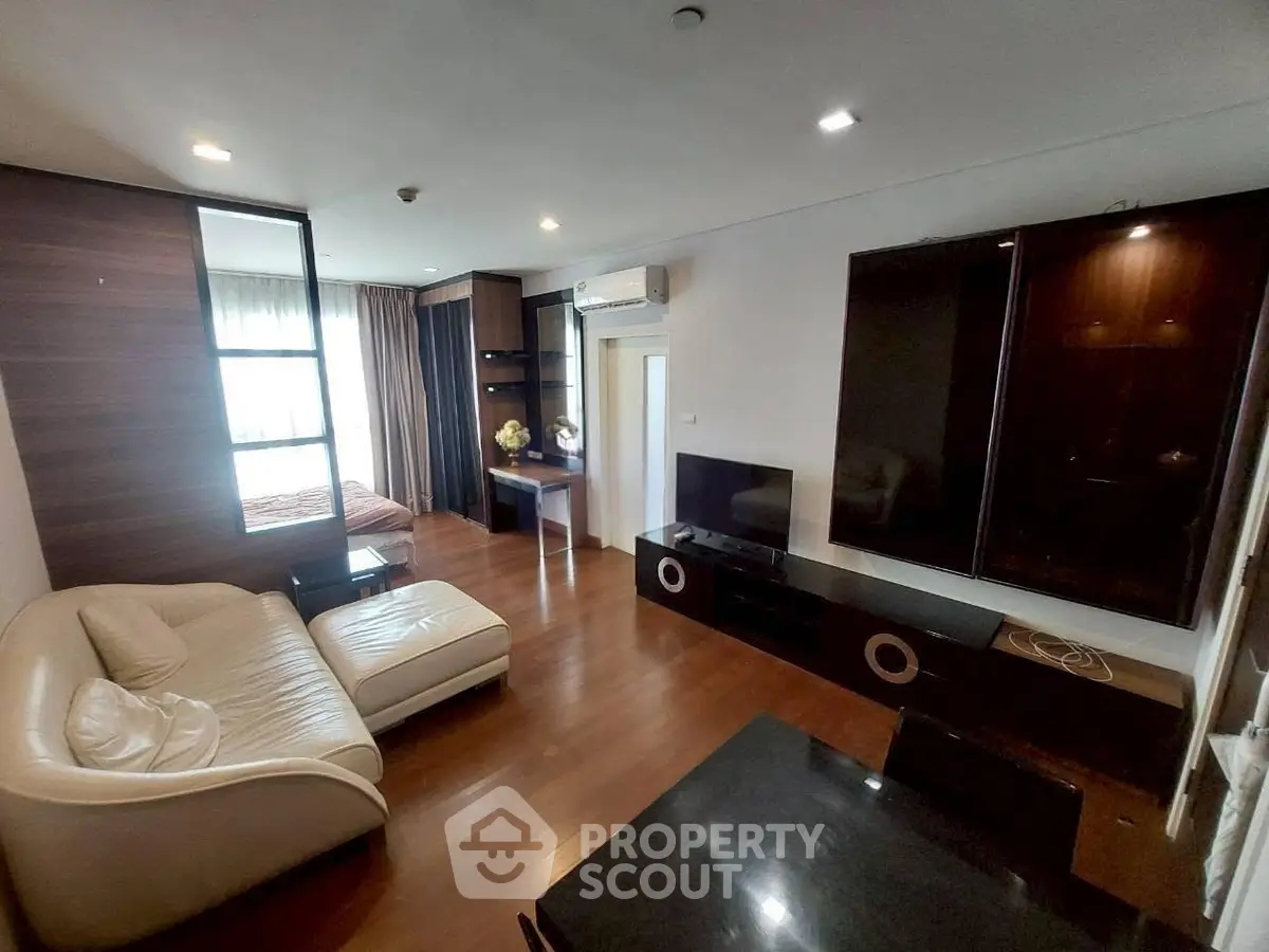Spacious modern living room with elegant furniture and wooden flooring