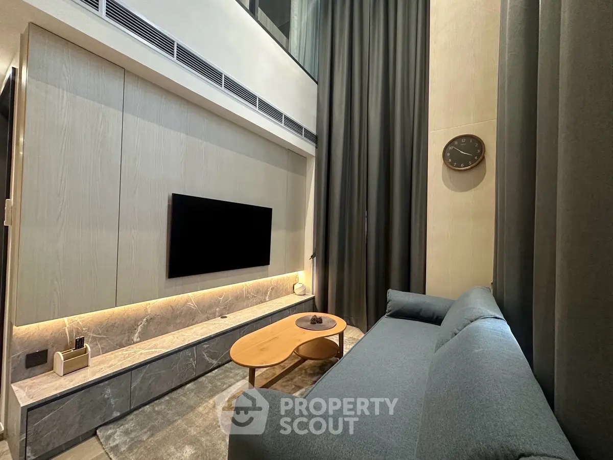 Modern living room with high ceiling and stylish decor