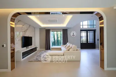 Luxurious modern living room with elegant design and spacious layout, featuring a large sofa and stylish decor.