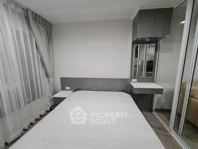 Modern bedroom with sleek design and ample natural light