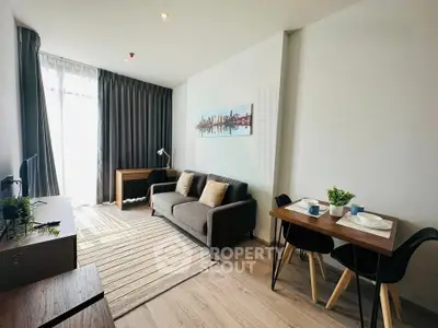 Modern living room with stylish decor and natural light in a contemporary apartment.