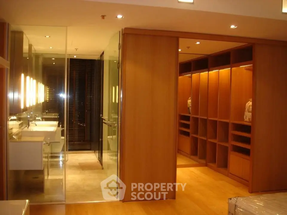 Luxurious modern bathroom with walk-in closet and elegant lighting