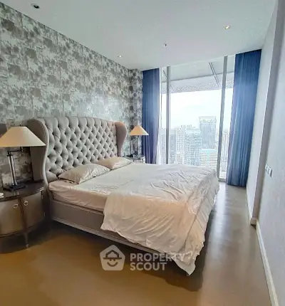 Luxurious bedroom with stunning city view and elegant decor