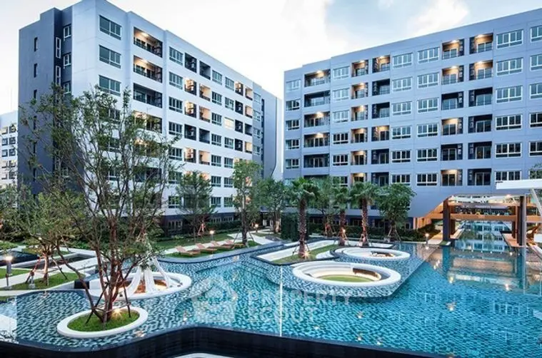 Luxurious modern apartment complex with stunning pool and landscaped gardens.