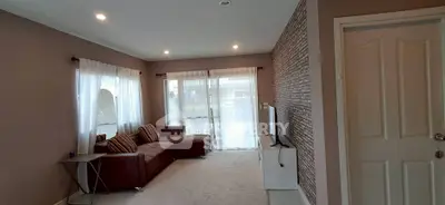 Spacious living room with modern decor and natural light