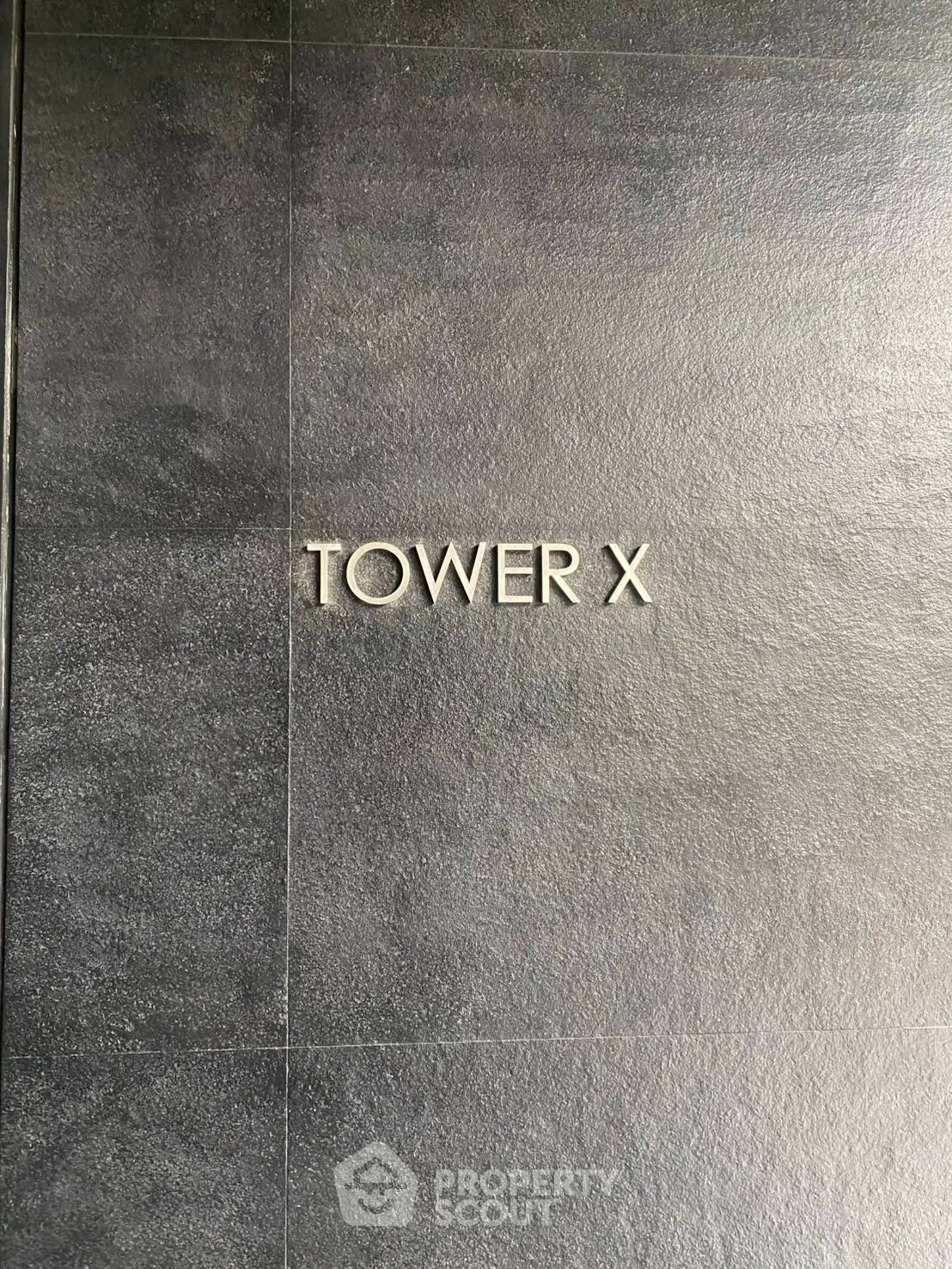 Elegant Tower X entrance with sleek modern design and minimalist style.
