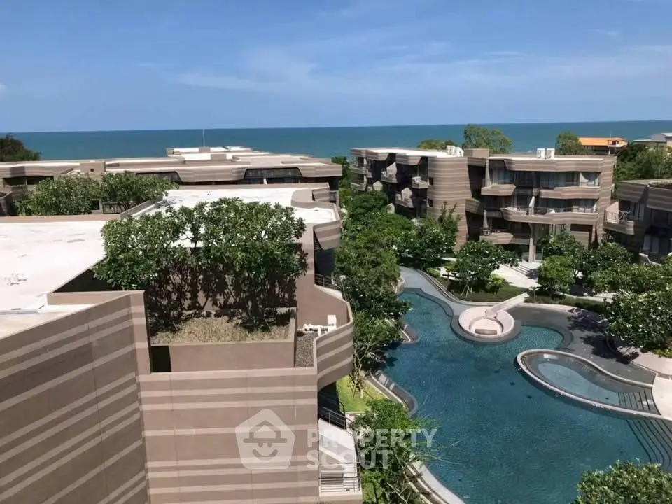 Luxurious beachfront condominium with stunning pool and ocean view.