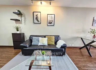 Stylish living room with modern decor and cozy seating area, perfect for relaxation and entertaining.