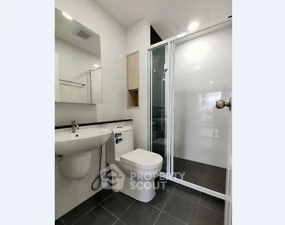 Modern bathroom with sleek shower and elegant fixtures