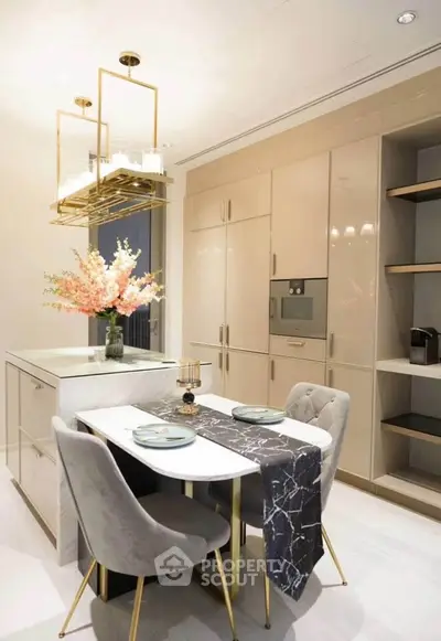 Luxurious modern kitchen with elegant dining setup and sleek cabinetry