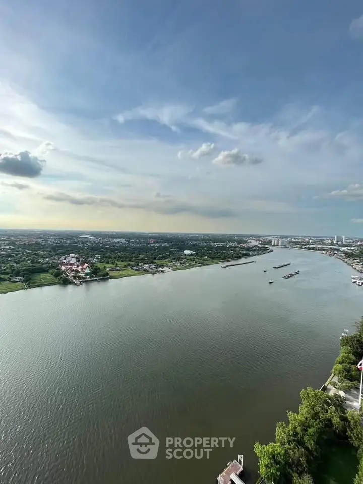 Stunning river view from high-rise building, perfect for serene living.