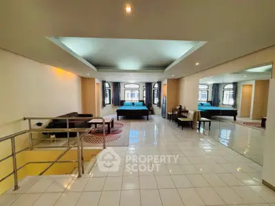 Spacious open-plan living area with modern design and ample natural light.