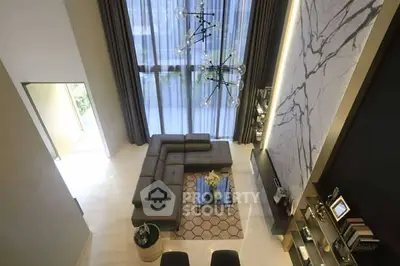 Luxurious modern living room with high ceiling and elegant decor