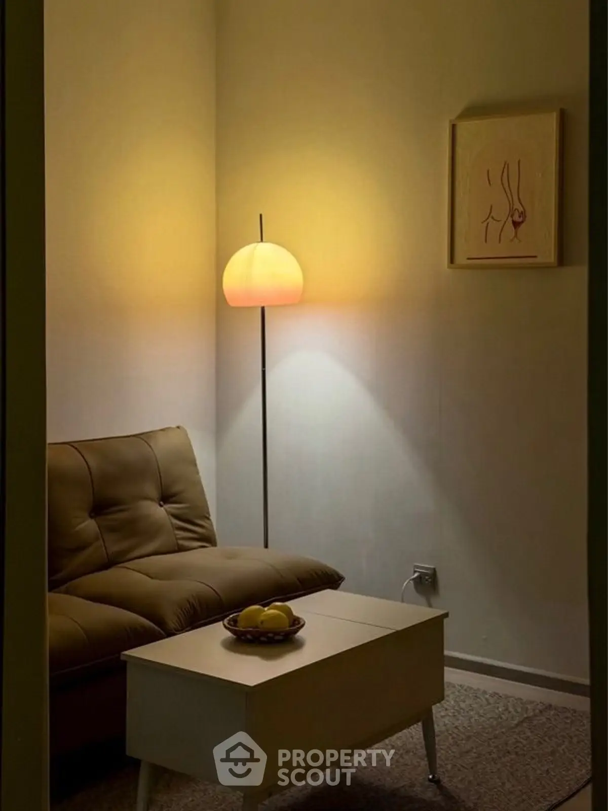 Cozy living room with modern lamp and stylish sofa, perfect for relaxation.