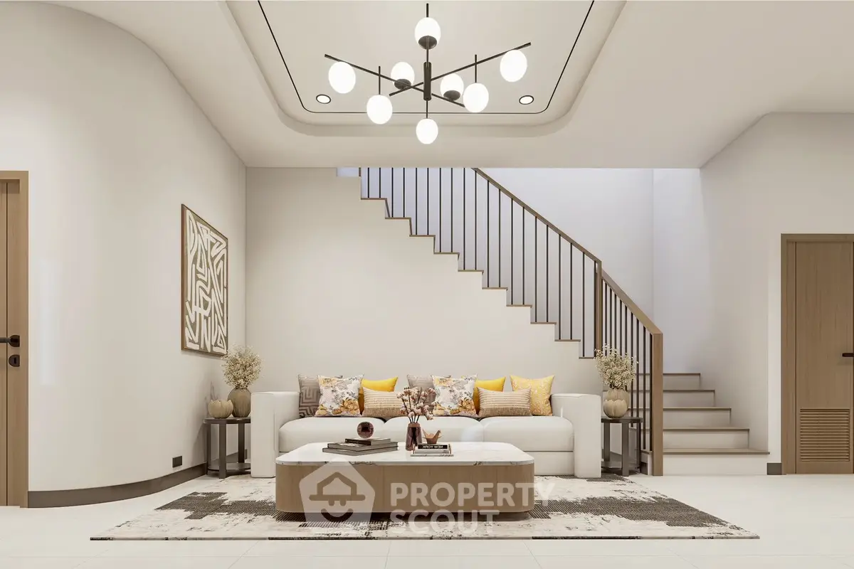 Modern living room with stylish decor and staircase, featuring elegant lighting and cozy seating area.