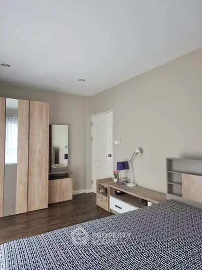 Modern bedroom with stylish wooden furniture and cozy decor