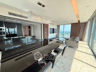 Luxurious modern living room with panoramic city views and elegant dining area.
