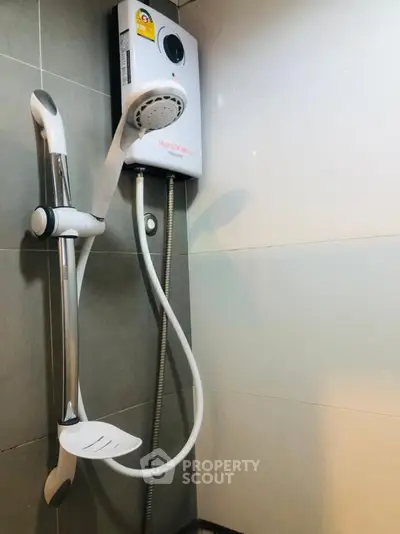 Modern bathroom with sleek shower unit and contemporary design.